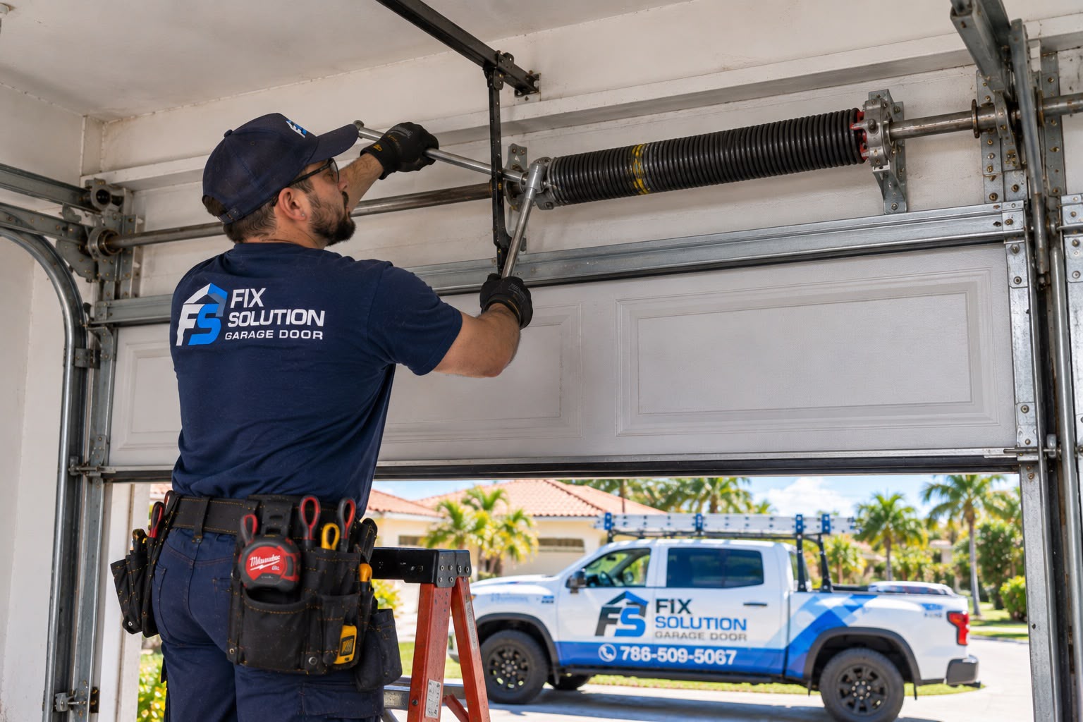 FIX SOLUTION GARAGE DOOR technician inspecting a garage door spring system before quoting a repair price in Miami, Florida